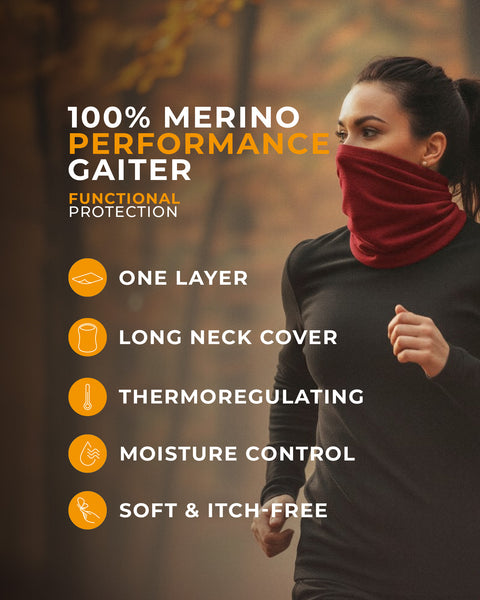 Woman wearing a red merino performance gaiter with features listed on a blurred autumn background