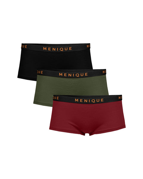 Three pairs of Menique men's boxer briefs stacked diagonally on a white background, featuring black, olive green, and burgundy red fabrics with black elastic waistbands and gold lettering.