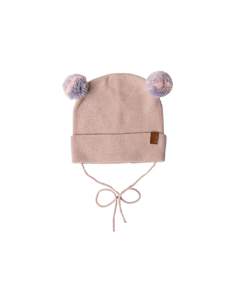Dusty pink baby beanie with pom-pom ears and chin ties on white background