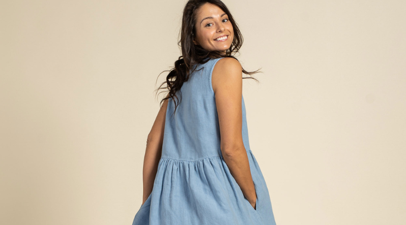 Woman wearing cloudy blue Linen dress. Dresses with pockets collection banner.