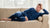 man lying on bed and wearing dark blue matching clothing set