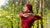 Woman outdoors wearing royal cherry merino wool headband.