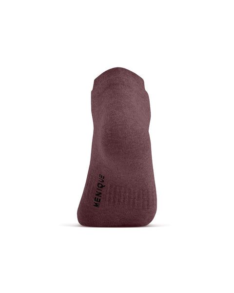 A back view of a dark pink ankle sock on a foot model, showing the heel and the word "MENIQUE" printed vertically on the lower left side.