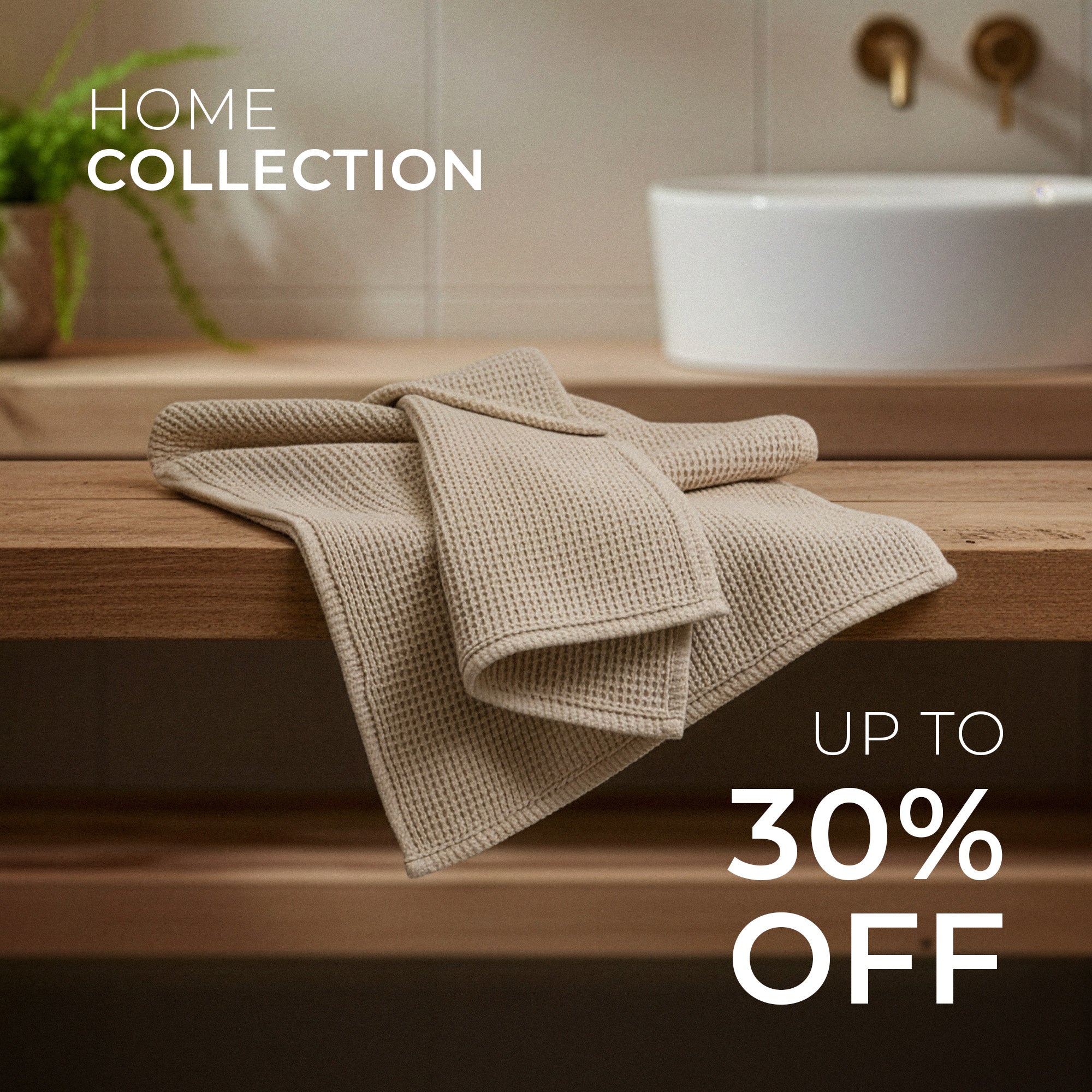 Folded beige towel on a wooden surface with a bathroom setting and promotional text overlay.