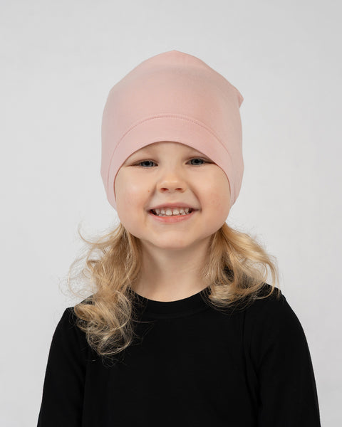 Kids bamboo beanie in blush pink, breathable and comfortable everyday headwear.