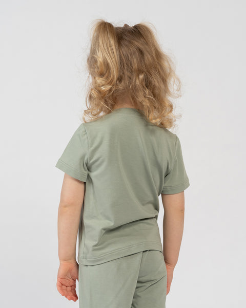 Kids green bamboo clothing set – side view of comfortable t-shirt and shorts for everyday wear