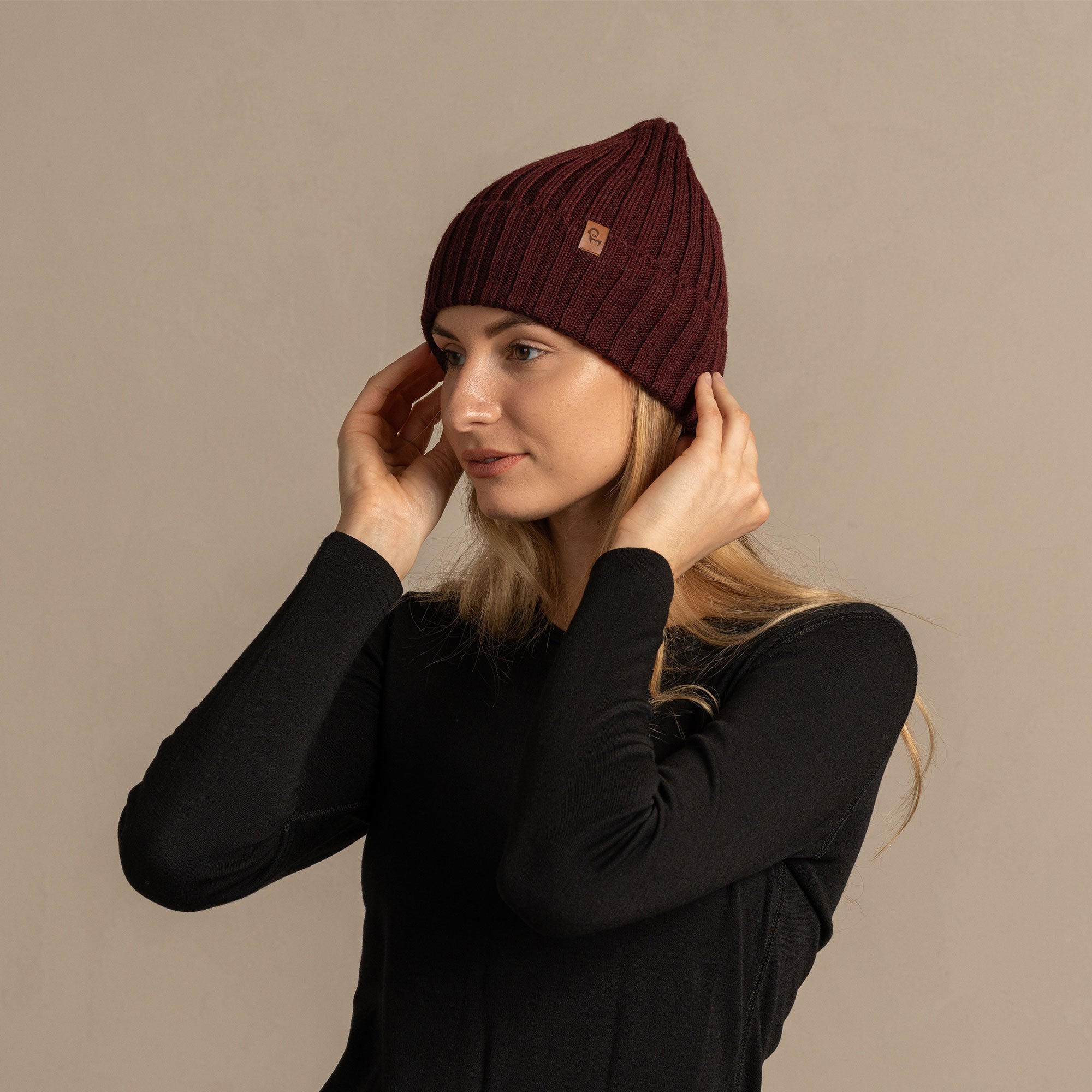 Women's Ribbed Beanie Knitted Merino in black color.