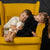 Two kids laying on the armchair