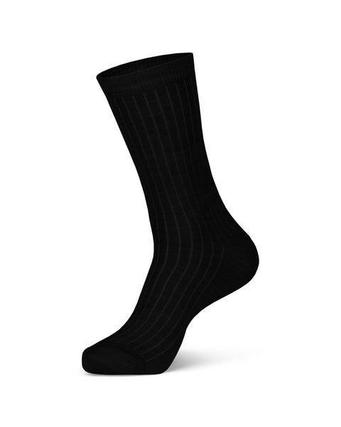 Women&#39;s Merino Rib Crew Socks in black color in a white background, side view.