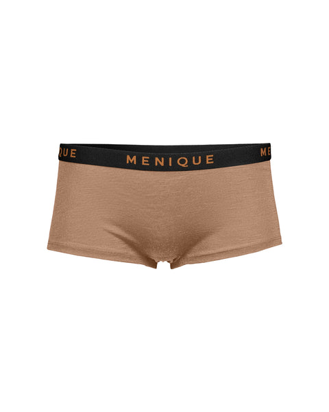 A flat-lay product shot of women's boxer-style underwear in a light beige color. The garment has a slightly ribbed texture and features a contrasting black elastic waistband with the brand name "MENIQUE" woven in light brown text. The background is pure white.