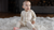Little toddler wearing natural Merino wool romper