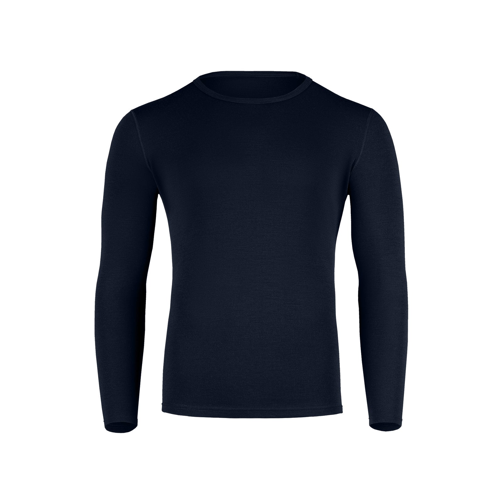 A studio portrait of a man standing with his hands loosely resting in his front pockets, wearing a dark navy long-sleeve top and jeans.