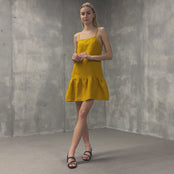 MENIQUE Linen dress Gloria. Mini style smock dress with spaghetti straps and square neckline in Spicy Yellow color.