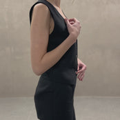 MENIQUE Linen vest Eve in pure black color matched with pleated Linen pants in pure black