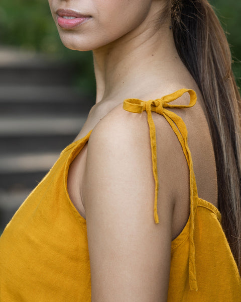 Woman is showing her dress&#39; shoulder straps